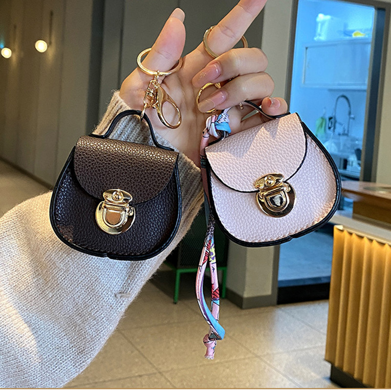 Luxury Designer Mini Saddle Headphone Bag Universal Headset Can hold other small items compact with keychain Storage Bags Portable