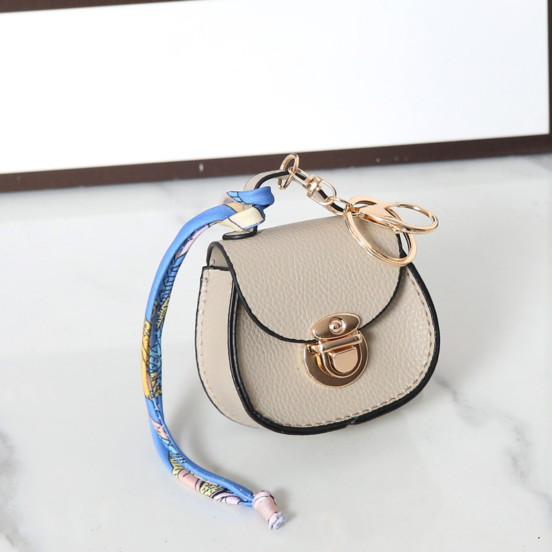 Luxury Designer Mini Saddle Headphone Bag Universal Headset Can hold other small items compact with keychain Storage Bags Portable