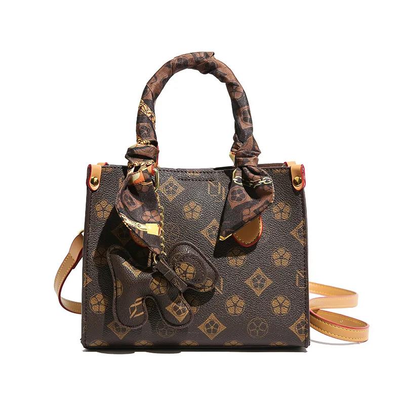 The new free shipping designer bag is a new brown khaki printed small handbag for women, a multi-functional and fashionable single-shoulder crossbody 