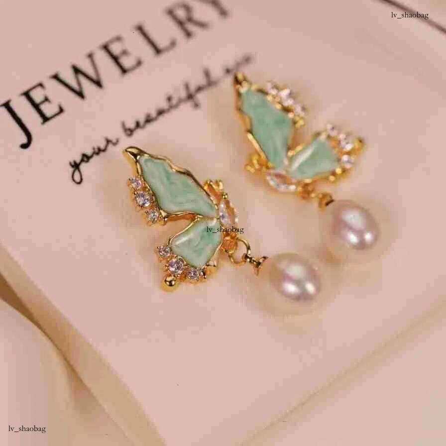 DHcollections Dan Tao S Sier Needle French Style Glazed Freshwater Rice-shaped Pearl Long Tassel Earrings for Women