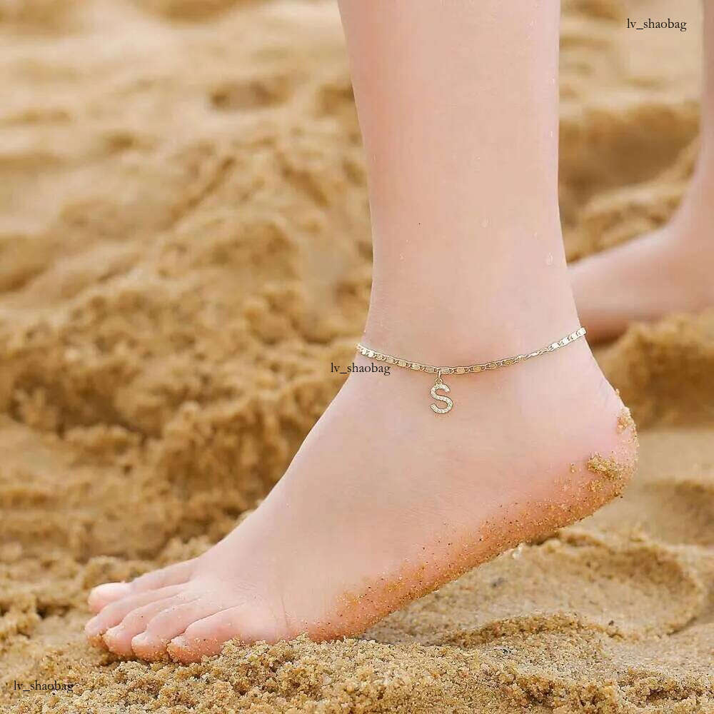 DHCollections Fashion Layered Gold Plated Stainless Steel Figaro Anklet Chain Bling Zircon 26 Initial Letter Charm Anklets for Women