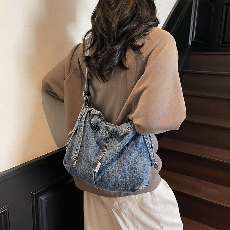 Large Capacity Drawstring Denim for designer Women 2025 Trendy New Niche Simple Shoulder Versatile bags Commuting Shopping Bag
