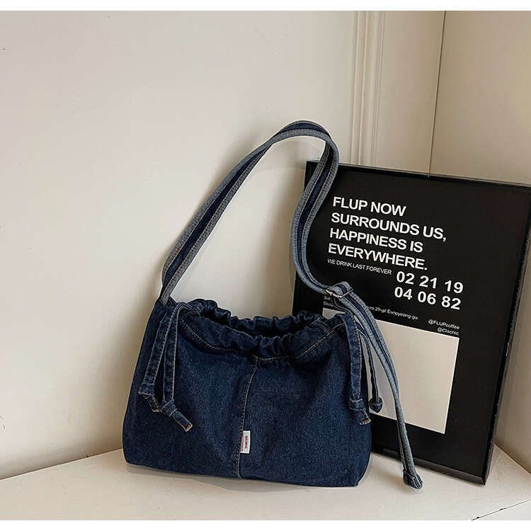 Large Capacity Drawstring Denim for designer Women 2025 Trendy New Niche Simple Shoulder Versatile bags Commuting Shopping Bag