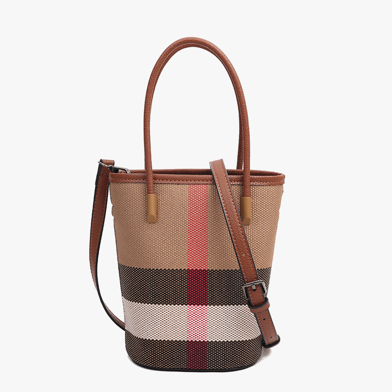 new stylish women's bags with a fashionable and high - quality feel Made of genuine leather and canvas featuring a checkered pattern Includes tot