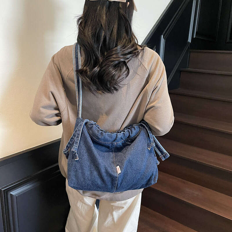 Large Capacity Drawstring Denim for designer Women 2025 Trendy New Niche Simple Shoulder Versatile bags Commuting Shopping Bag