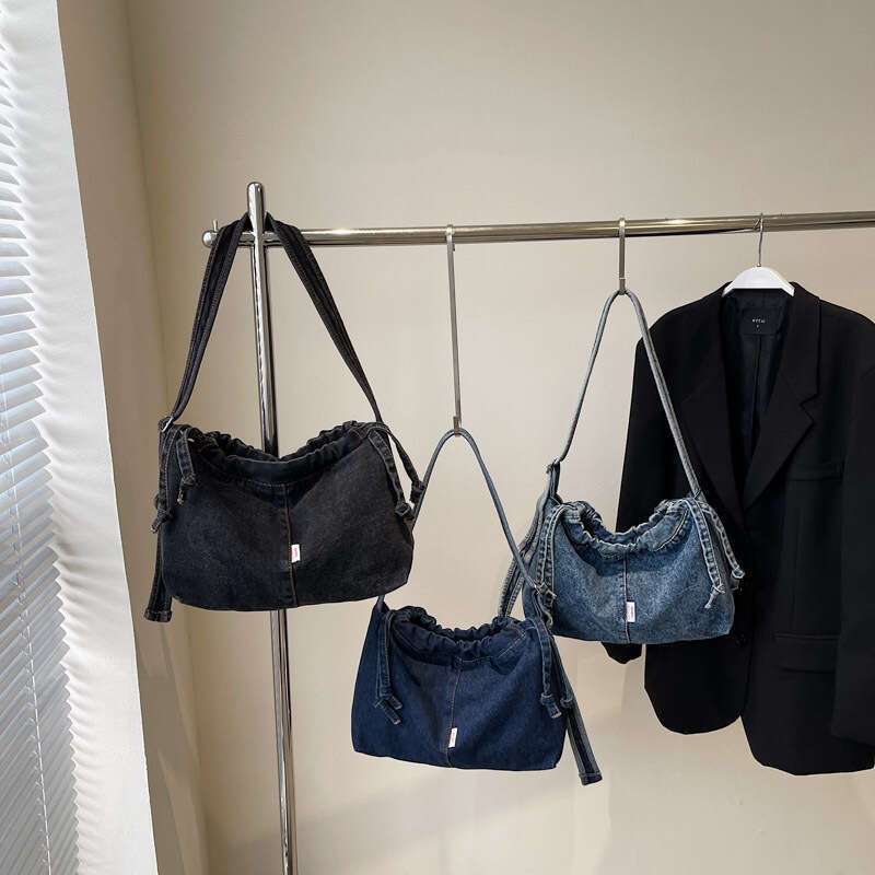 Large Capacity Drawstring Denim for designer Women 2025 Trendy New Niche Simple Shoulder Versatile bags Commuting Shopping Bag