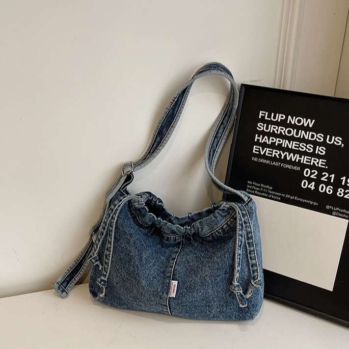 Large Capacity Drawstring Denim for designer Women 2025 Trendy New Niche Simple Shoulder Versatile bags Commuting Shopping Bag