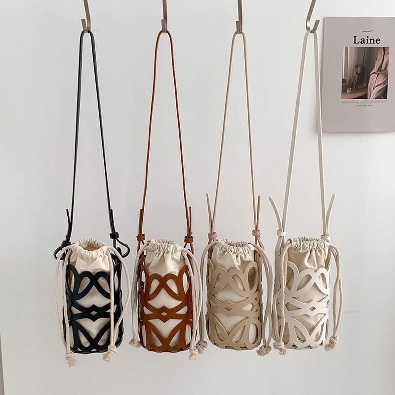 Niche Design Bag Womens Canvas Shoulder Phone Bag Versatile PU Leather Hollow Crossbody Cylinder Bucket Bag for Women 250804