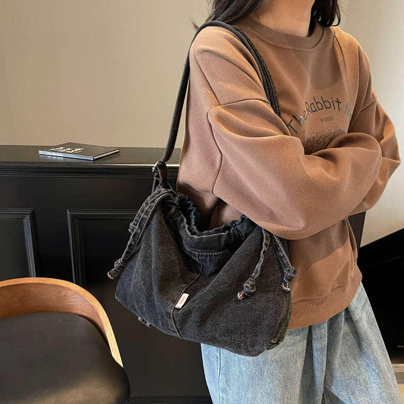 Large Capacity Drawstring Denim for designer Women 2025 Trendy New Niche Simple Shoulder Versatile bags Commuting Shopping Bag