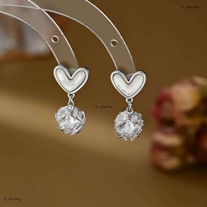 DHCollections Spring Summer Zircon Flower Stud Korean Fashion High-End Mother-of-Pearl Heart Design - 14K Gold Plated Needle Earrings for Women