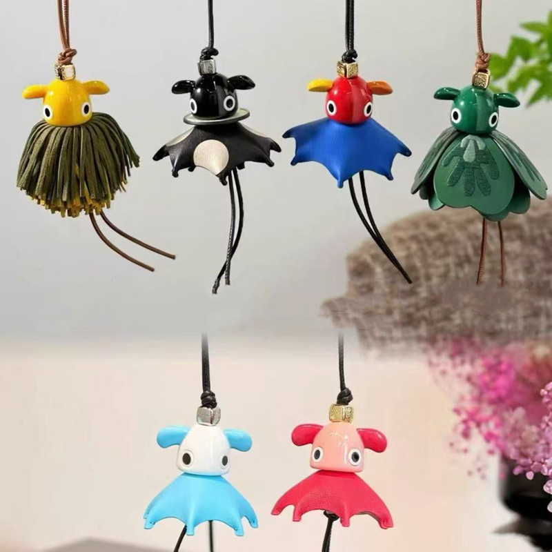 Designer Bag Charms first layer cowhide strap and Anagram dice Classic Cowboy Parrot Puzz charm Bag Hanger new couple pendant elf bag pendant Purse key car hanging
