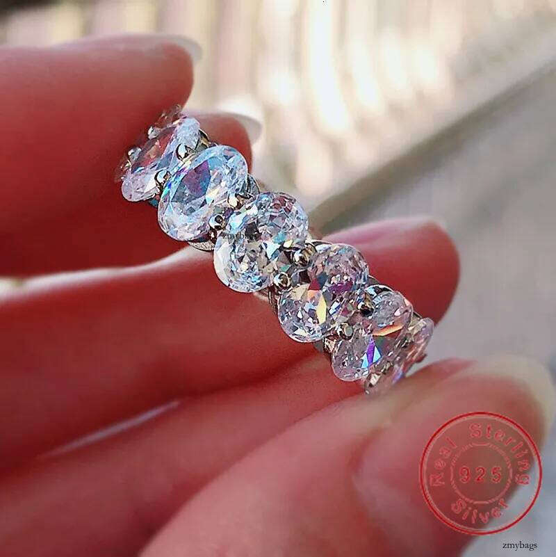 2025 Rulalei Ins Top Sell Gorgeous Jewelry Pure 100% Sterling Sier Oval Cut Stack Lab White Moissanite Dia Eternity Lady Women Wedding Band Ring Gift