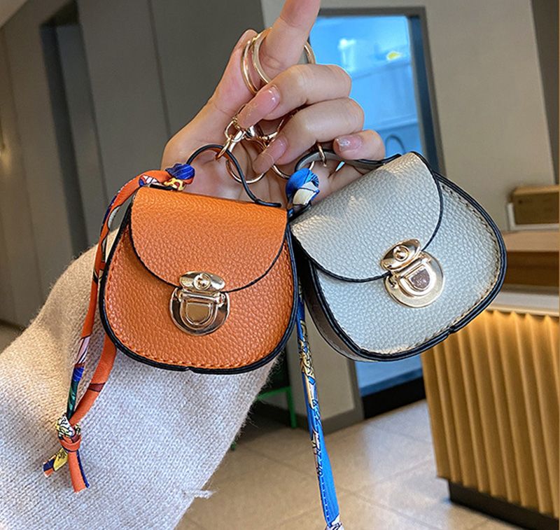 Luxury Designer Mini Saddle Headphone Bag Key Chain Bags Universal Headset Can hold other small items with keychain Storage Bags