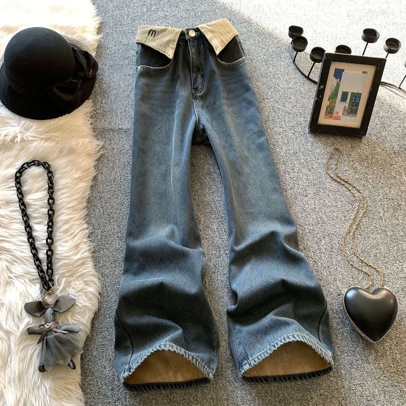 New style from luxury designer brand Mu*, cuffed logo jeans, straight-leg, retro, high-waisted, slimming, wide-leg pants in light blue.