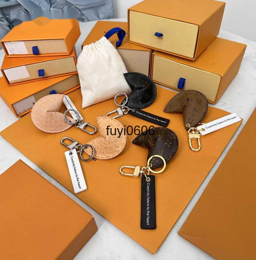 Designer Keychains Lanyards Fortune Cookie Bag Hanging Car Flower Charm Jewelry Women Men Gifts Fashion PU Leather Key Chain Accessories Motion current 66e