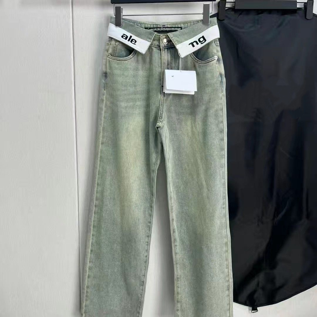 New style from luxury designer brand Mu*, cuffed logo jeans, straight-leg, retro, high-waisted, slimming, wide-leg pants in light blue.