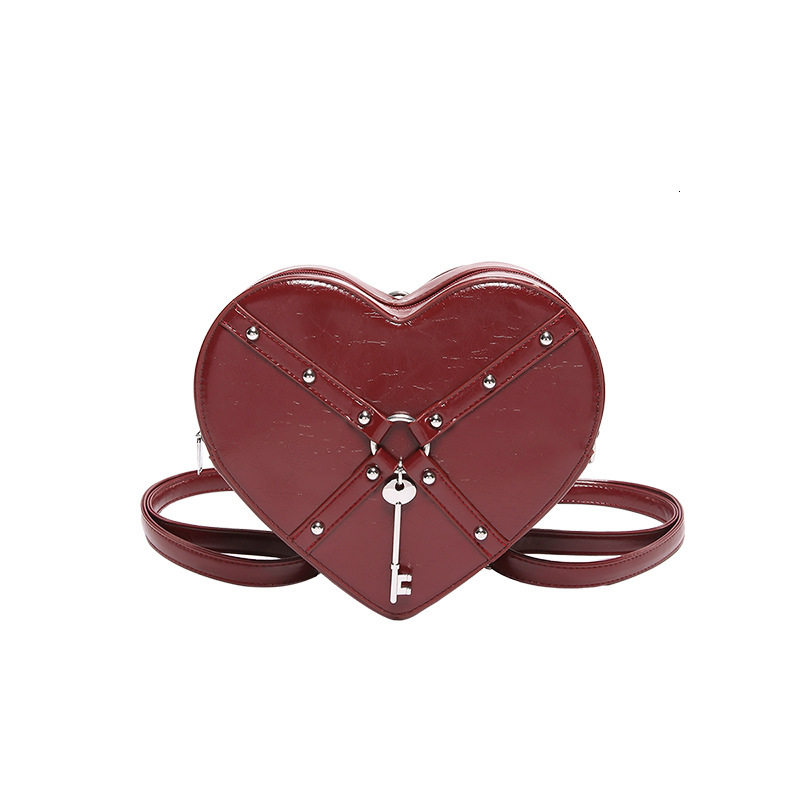 Free shipping designer Unique Hot Girl Heart Bag Women New Trend Rivet Motorcycle Style Shoulder Bag Crossbody Bag Personality Backpack