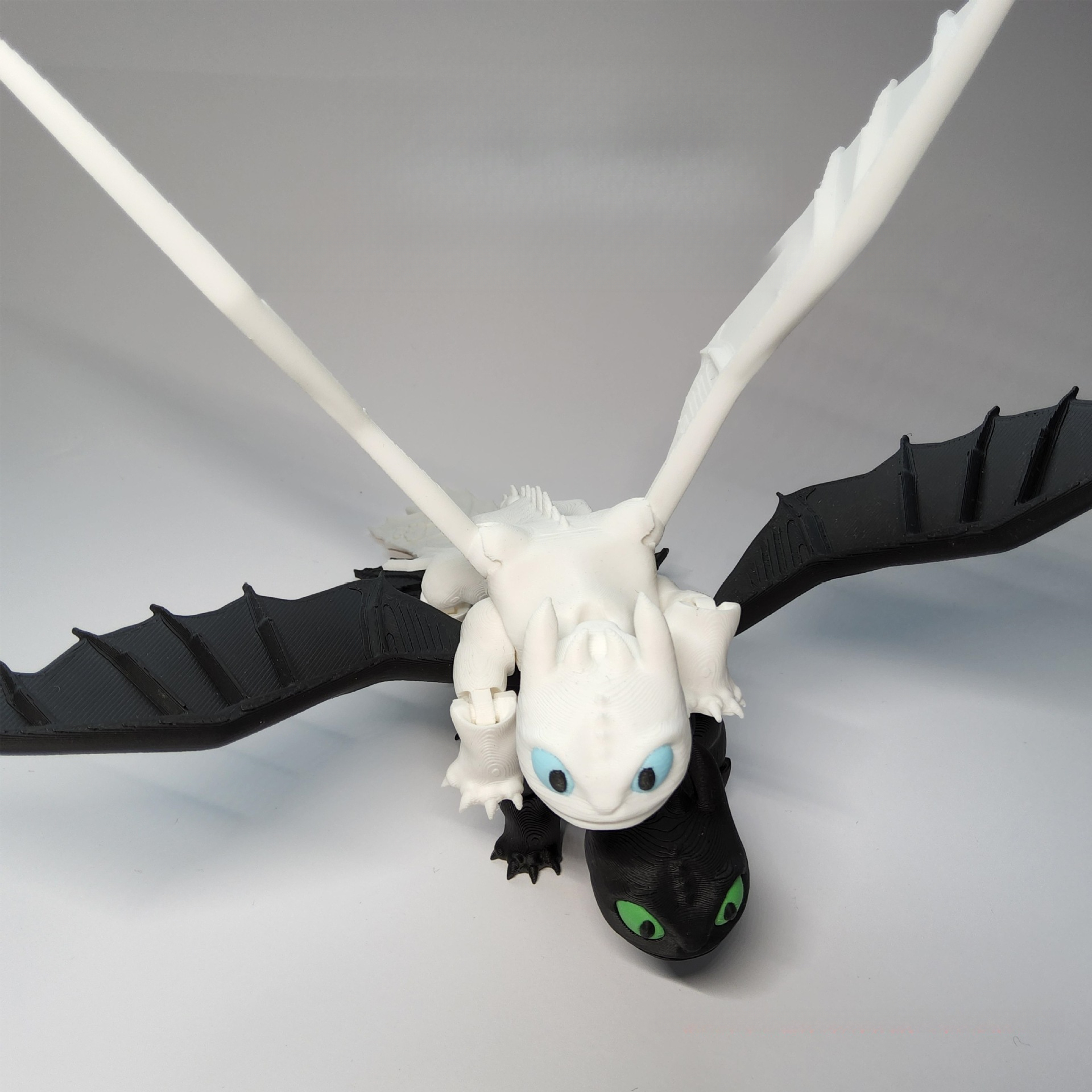 3D Printed Toothless Toy Doll: Articulated, Multi - colored Figurine Model