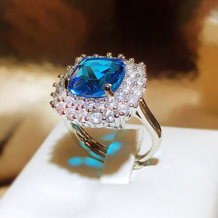 Silver Tone Square Blue Gem Ring With Round Sparkling Stone Halo Accents Glam Evening And Special Occasion Accessory Gift For Her Luxurious And Dazzli