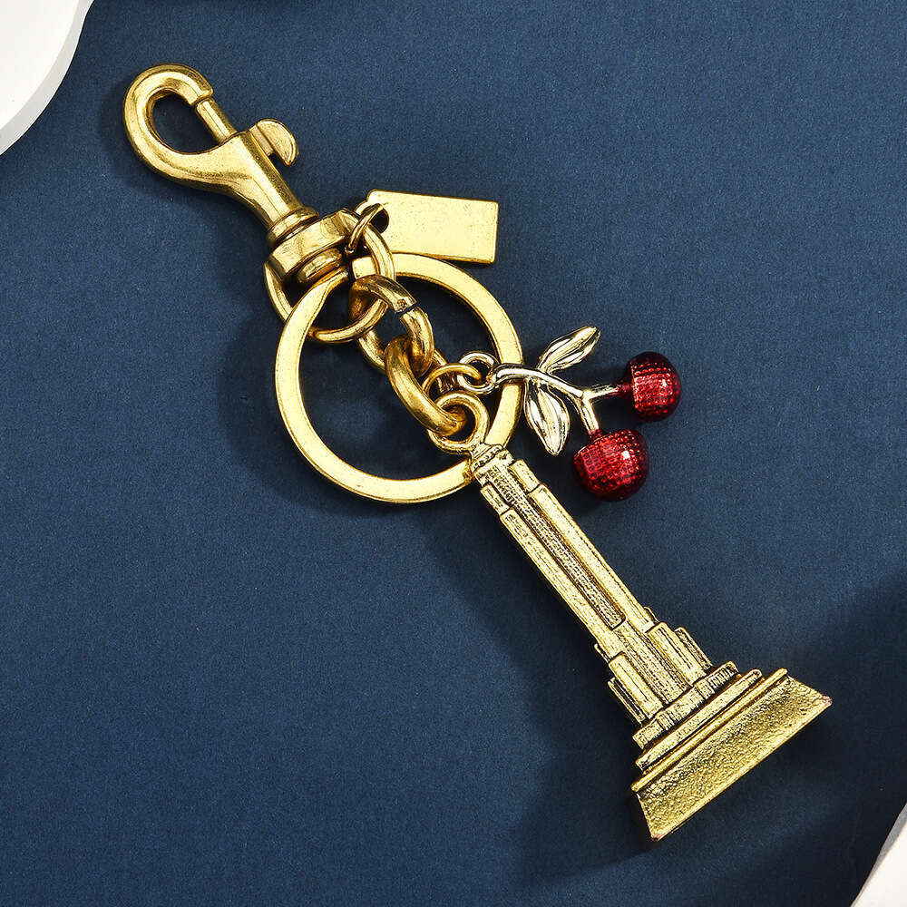 DHpet_wholesale Trendy Cherry & Eiffel Tower Keychain - Fashion Metal Bag Charm in Gold/Silver, Stylish Key Ring Accessory (10cm, 50g)