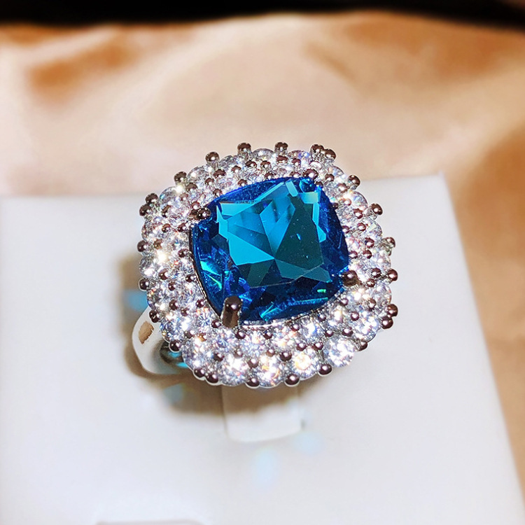 Silver Tone Square Blue Gem Ring With Round Sparkling Stone Halo Accents Glam Evening And Special Occasion Accessory Gift For Her Luxurious And Dazzli