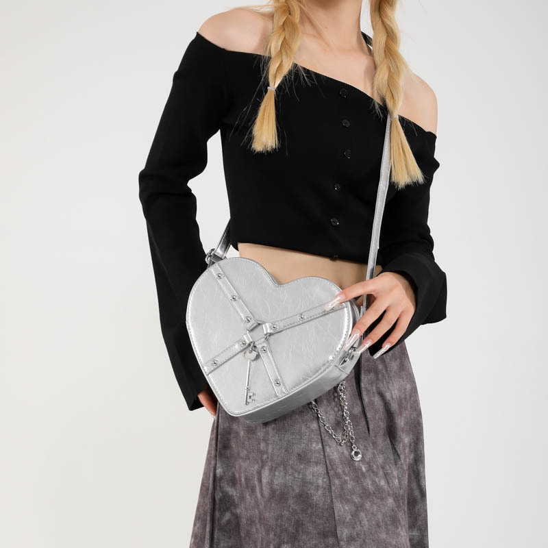 Free shipping designer Unique Hot Girl Heart Bag Women New Trend Rivet Motorcycle Style Shoulder Bag Crossbody Bag Personality Backpack