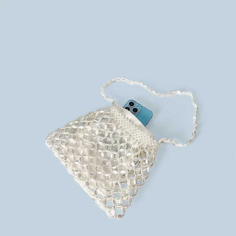 New handheld niche design silver handmade bead woven handbag essential for summer shoulder bag Z250807