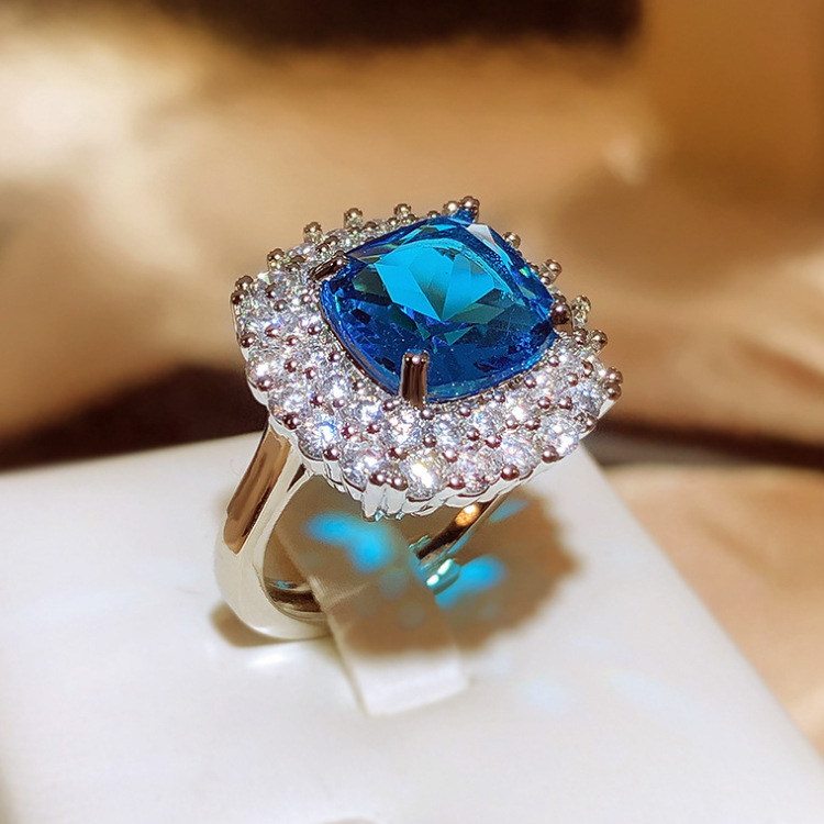 Silver Tone Square Blue Gem Ring With Round Sparkling Stone Halo Accents Glam Evening And Special Occasion Accessory Gift For Her Luxurious And Dazzli