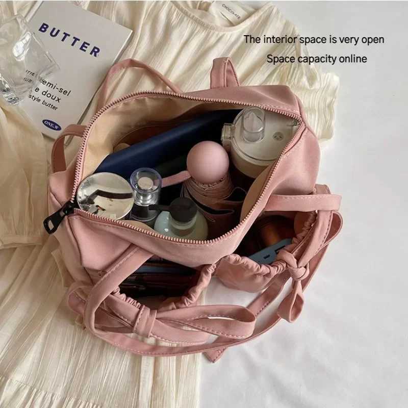 2024 New Korean Bow Nylon Shoulder Bag Folded Large Capacity Commuter Womens Handbag Fashionable and Sweet Design Tote Bag Z250807