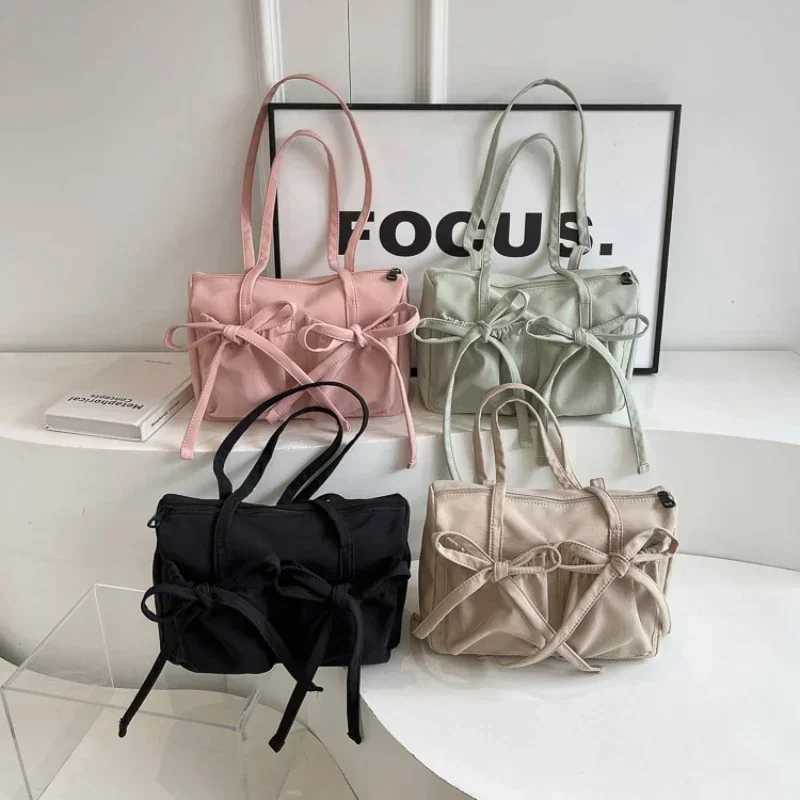 2024 New Korean Bow Nylon Shoulder Bag Folded Large Capacity Commuter Womens Handbag Fashionable and Sweet Design Tote Bag Z250807