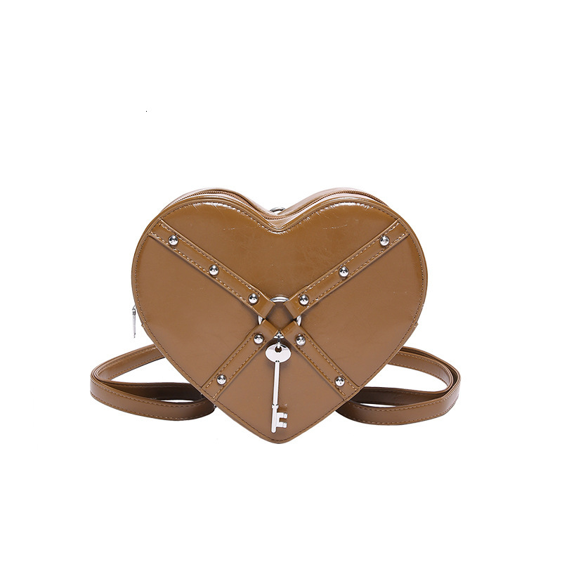 Free shipping designer Unique Hot Girl Heart Bag Women New Trend Rivet Motorcycle Style Shoulder Bag Crossbody Bag Personality Backpack