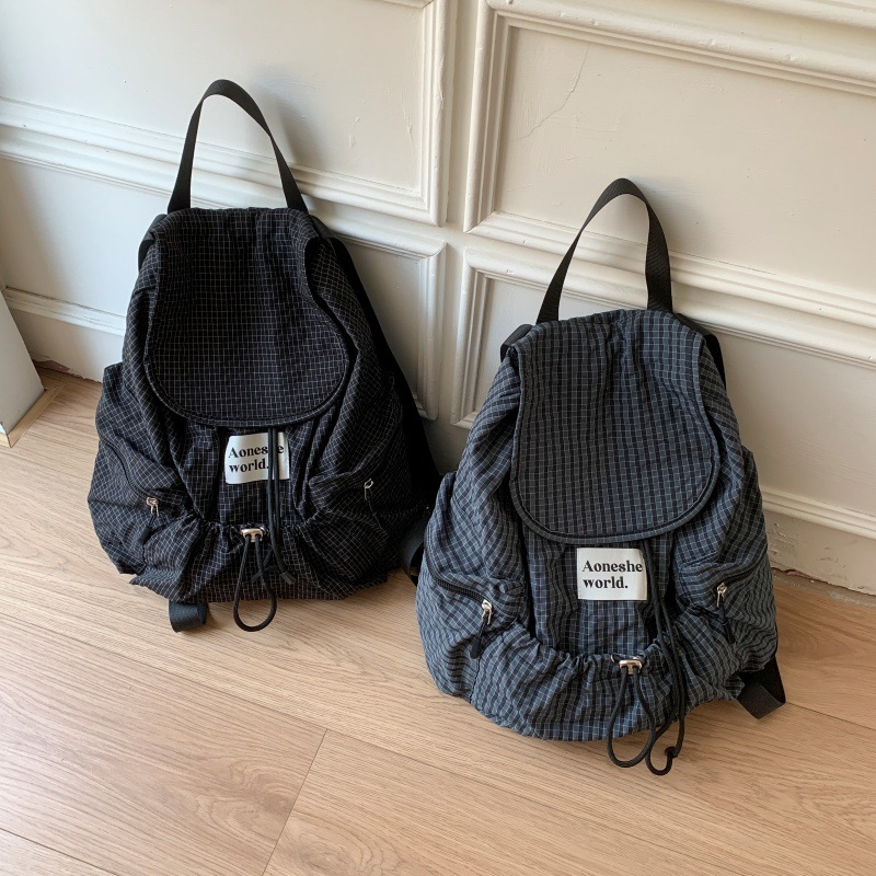 2025 Autumn fashion New Women s Backpack Simple Style Large Capacity Pulling Rope Women s Backpack Autumn Multi Pocket Grid New Designer Backpack