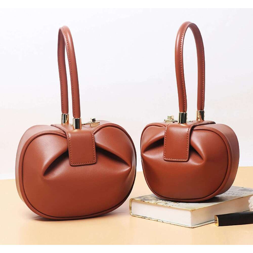 Genuine leather handbag shoulder retro fashion unique design versatile dumpling bag high-end solid color women bag in shape