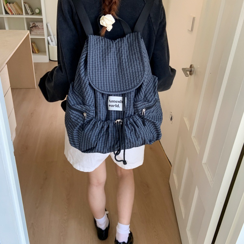 2025 Autumn fashion New Women s Backpack Simple Style Large Capacity Pulling Rope Women s Backpack Autumn Multi Pocket Grid New Designer Backpack