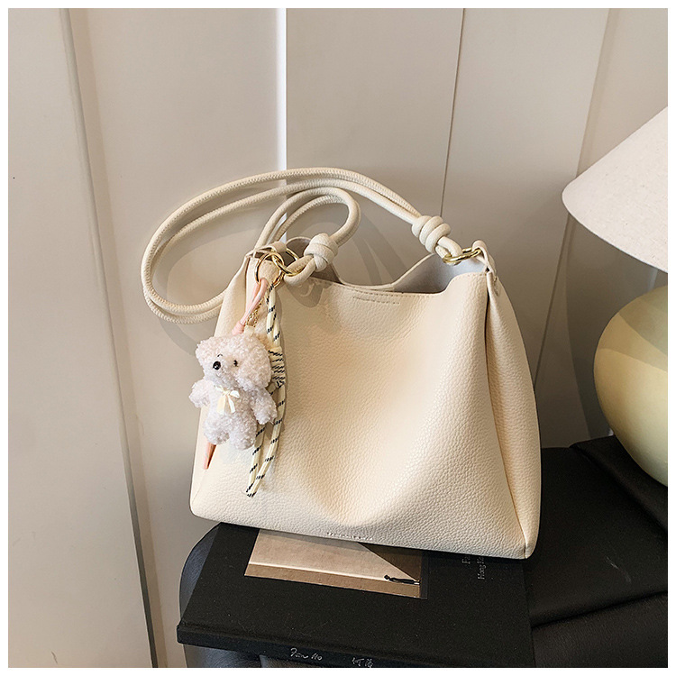 2025 Autumn New Women s Shoulder Bag Large Capacity Women s fashion Fresh and niche Handbag Cute Pendant Autumn New Designer Bag New Women s Crossbody