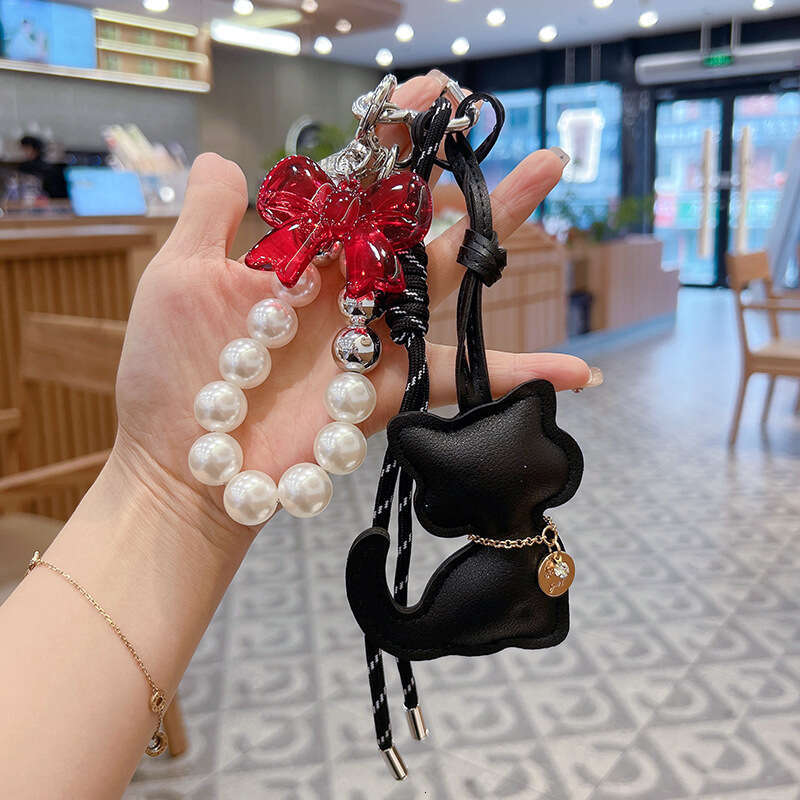 New Leather Cat Beaded Handwoven Rope Fashion Versatile Car Keychain Bag Pendant