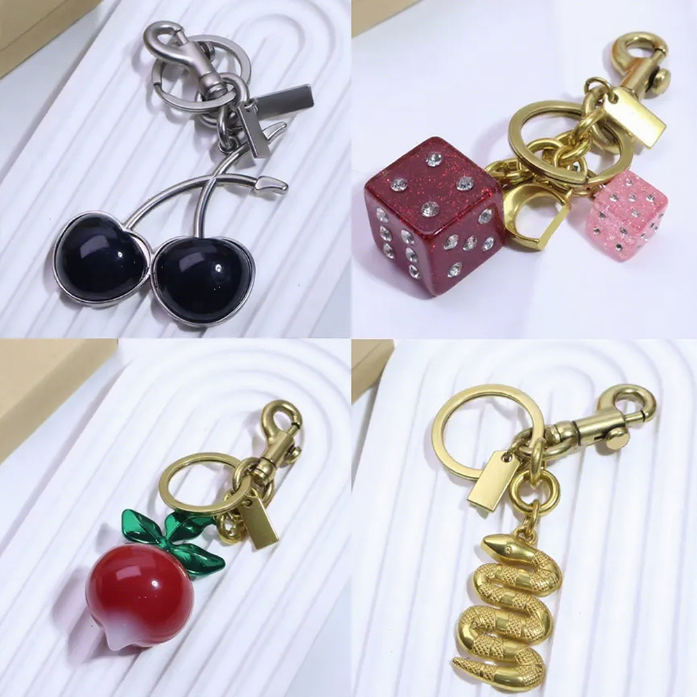 Luxury Fruit Keychain For Womens Cherry Bag Charm Brand Designer Key Ring Womens Bag Pendant Flower Letters Buckle Car Keychains Handmade Key Chain Bracelet