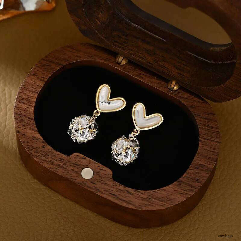 DHCollections Spring Summer Zircon Flower Stud Korean Fashion High-End Mother-of-Pearl Heart Design - 14K Gold Plated Needle Earrings for Women 8b