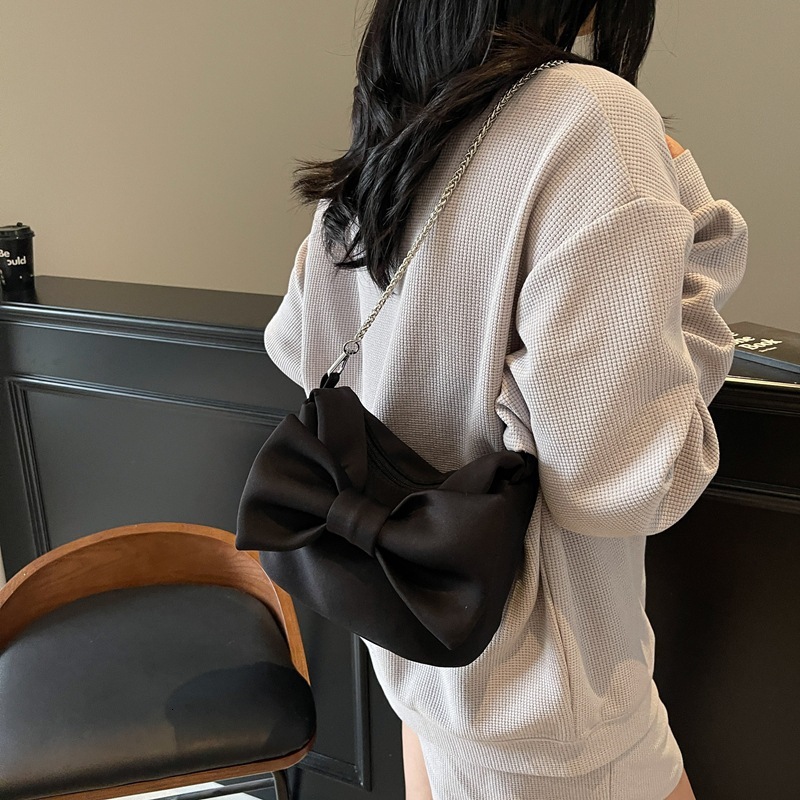 2025 Autumn new sweet girl pink bow women s handbag new casual shoulder bag fashion chain new women s crossbody bag autumn new designer bag