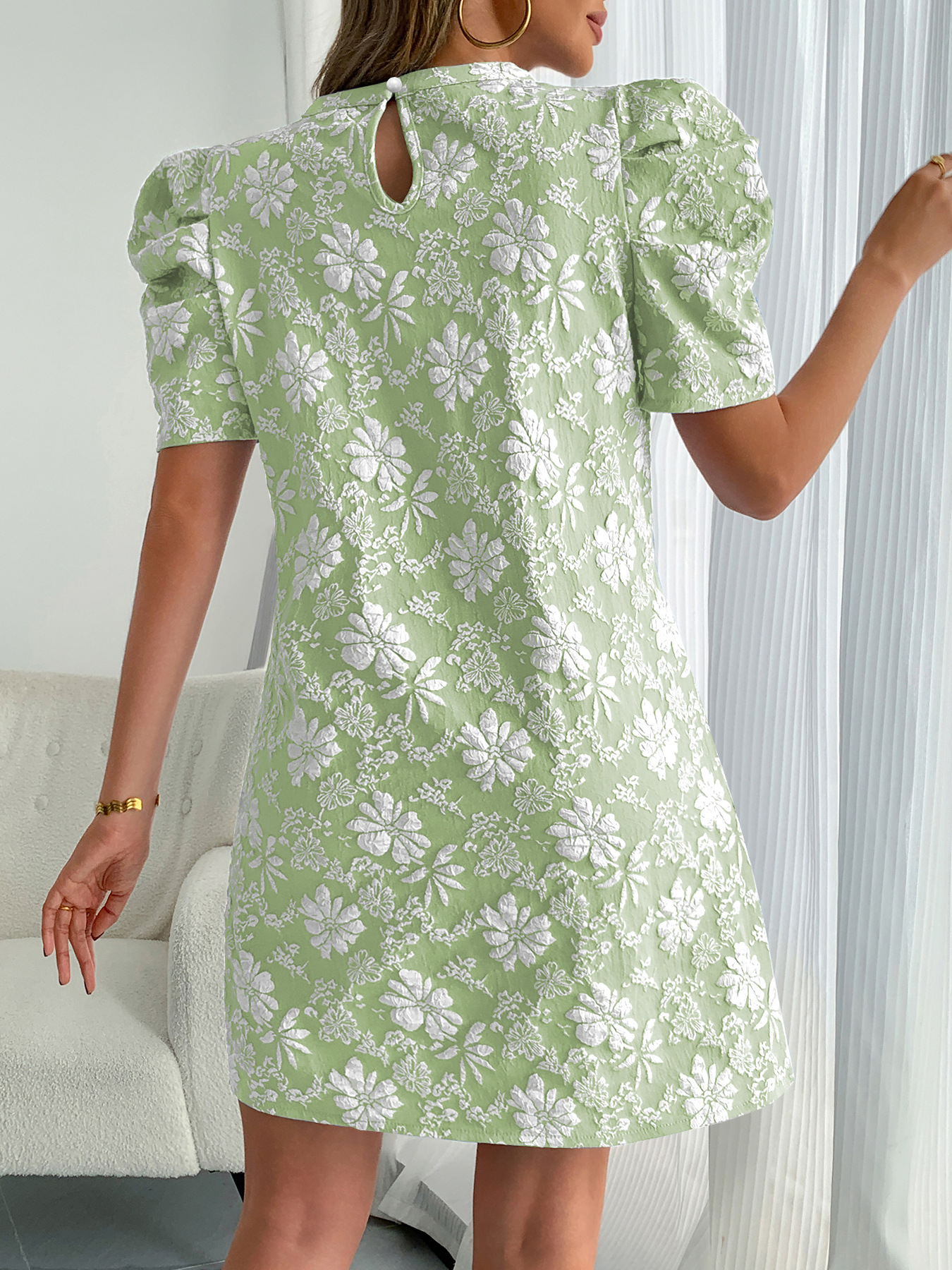 Lady's blue jacquard dress with puff sleeves