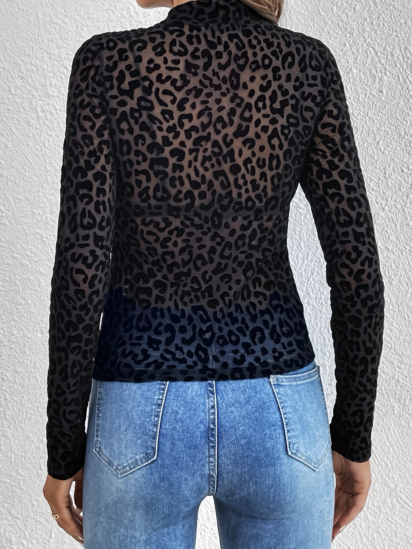 Lady's black leopard print mesh turtleneck top