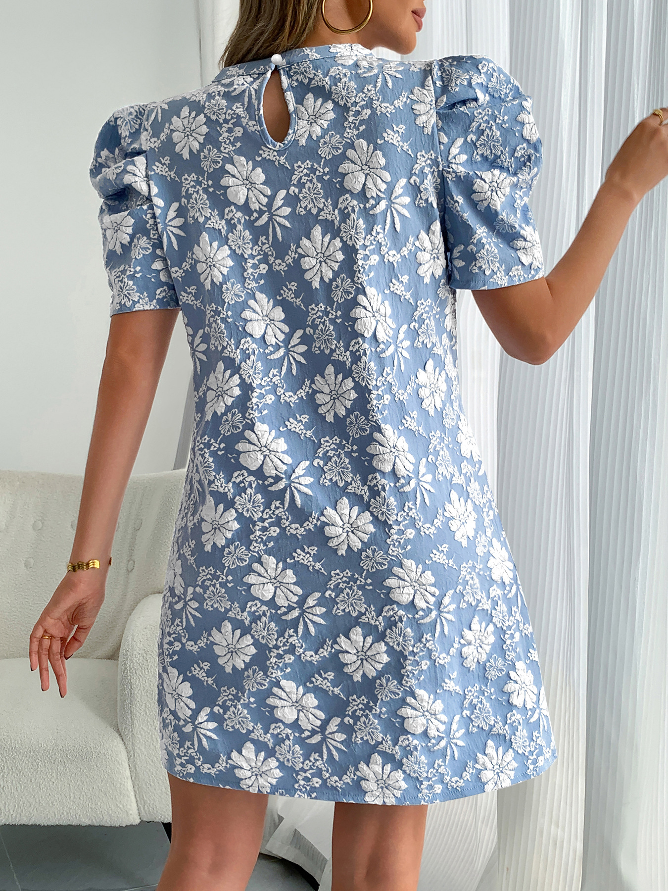 Lady's blue jacquard dress with puff sleeves
