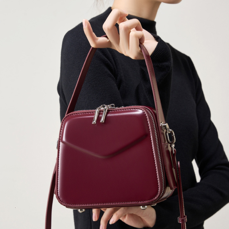 25 Spring Summer New Niche Design Ear-Hanging Series Handheld Brim Genuine Leather Women's Commuter Crossbody Bag