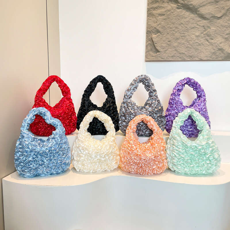 Hot Selling New Style Personality Pleated Women's Niche Design Fashion Handbag Elegant Commuter Handheld Evening Bag Designer Bags