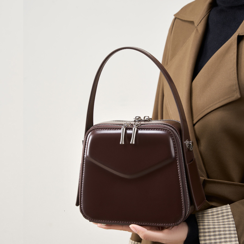 25 Spring Summer New Niche Design Ear-Hanging Series Handheld Brim Genuine Leather Women's Commuter Crossbody Bag