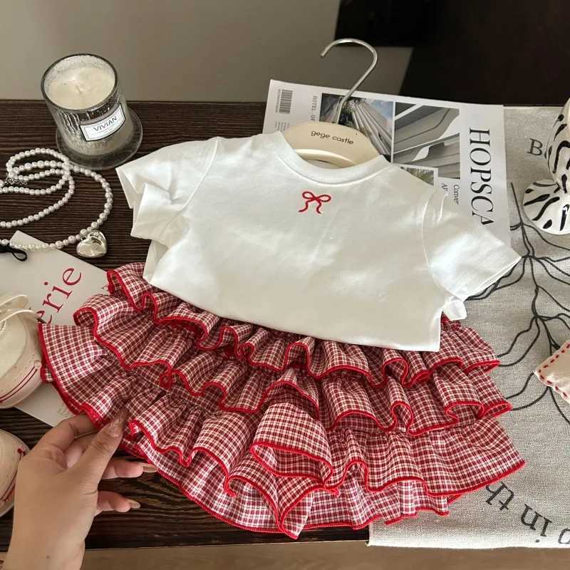 2025 New Summer Korean Childrens Clothing Girls Bow White T-shirt Childrens Checkered Cake Skirt Pants Two-Piece Set Z250811
