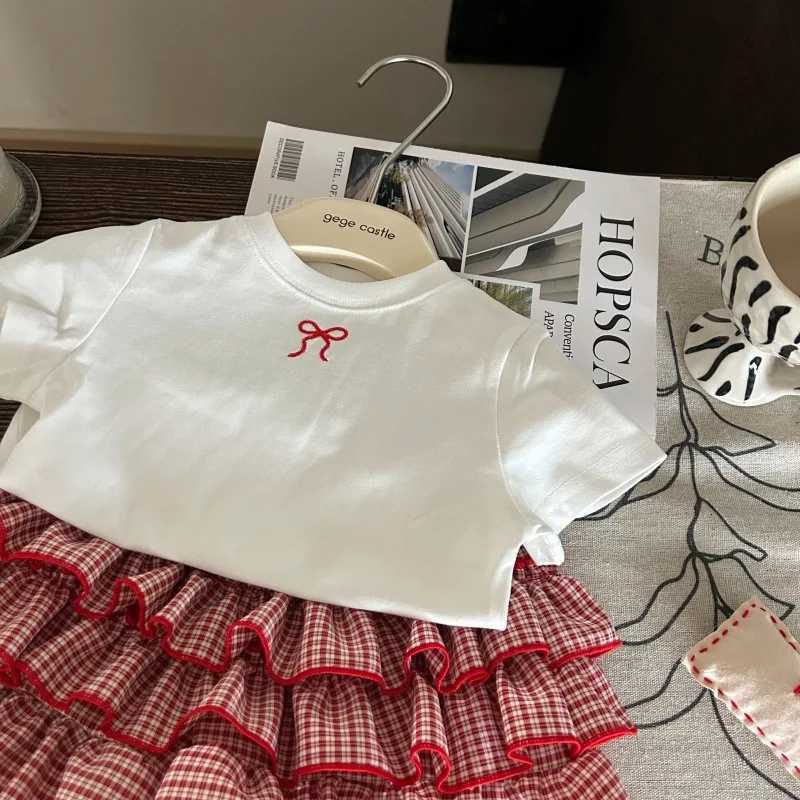 2025 New Summer Korean Childrens Clothing Girls Bow White T-shirt Childrens Checkered Cake Skirt Pants Two-Piece Set Z250811