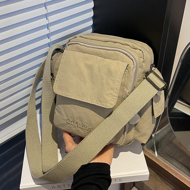 Hot Selling Waterproof Lightweight Nylon Women's New Outdoor Casual Shoulder Crossbody Multi-Pocket Camera Bag ddmymoon