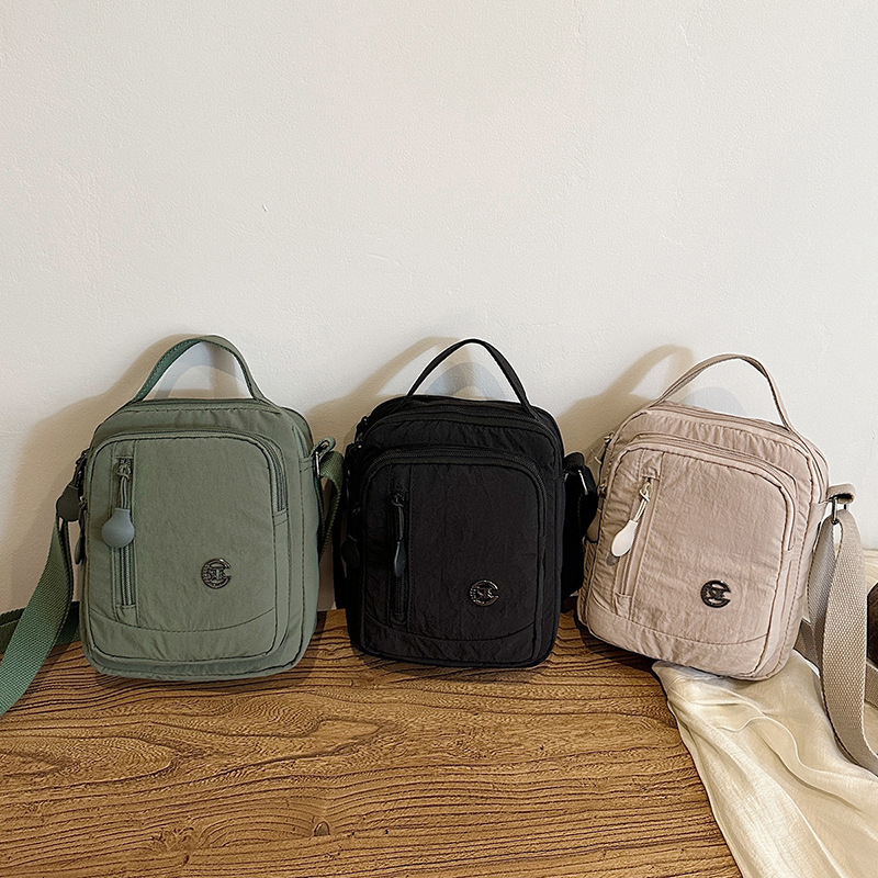 Lightweight waterproof nylon unisex outdoor casual multi-compartment large capacity shoulder crossbody bag ddmymoon