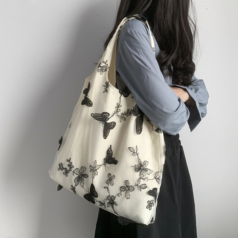 Autumn new embroidered black butterfly canvas bag lace casual travel women's shoulder bag niche design capacity women's crossbody bag Autumn